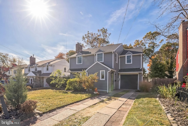 view of front property with a front yard and a garage