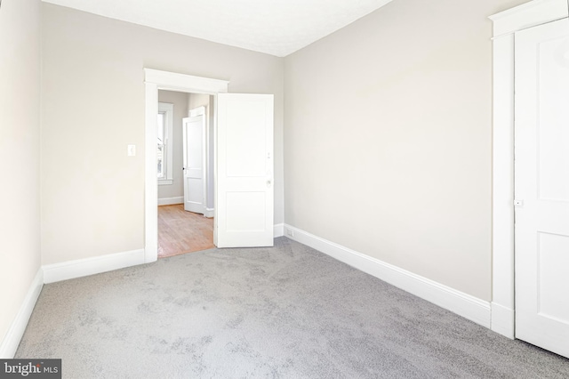 empty room featuring light colored carpet