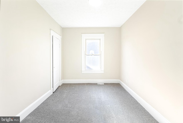 empty room featuring carpet flooring