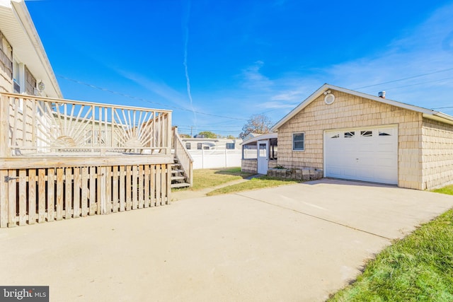 exterior space featuring an outbuilding and a garage