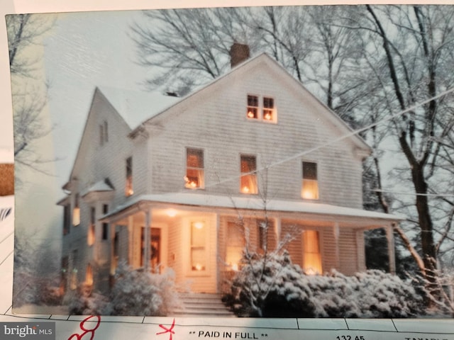 farmhouse-style home with covered porch