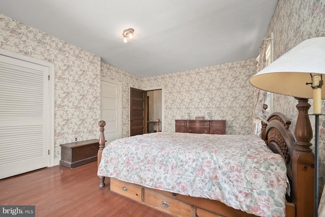 bedroom with hardwood / wood-style floors