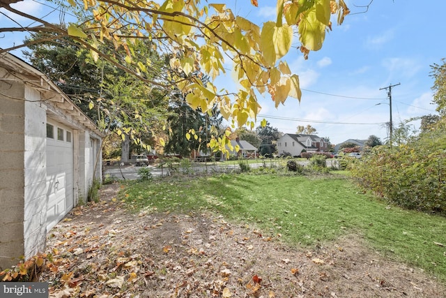 view of yard featuring a garage