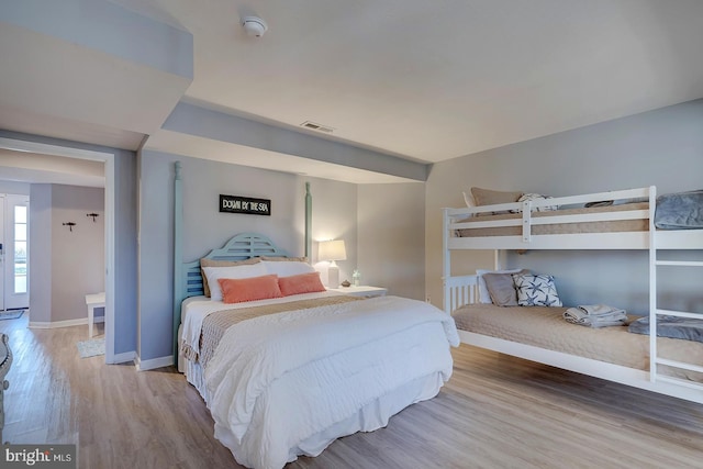 bedroom with wood-type flooring