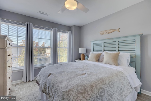 bedroom featuring hardwood / wood-style flooring and ceiling fan