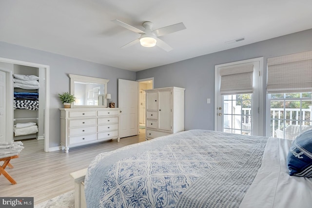 bedroom with light hardwood / wood-style flooring, access to exterior, and ceiling fan