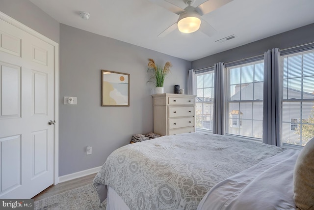 bedroom featuring light hardwood / wood-style floors and ceiling fan