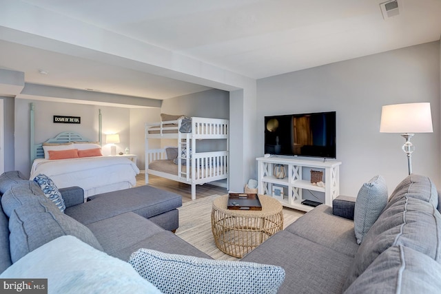 bedroom with hardwood / wood-style flooring