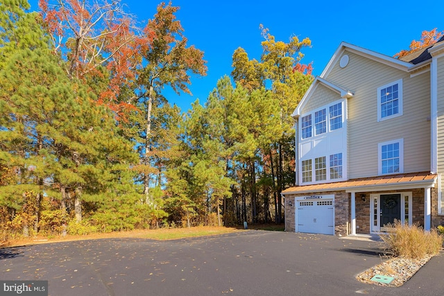 view of property exterior with a garage