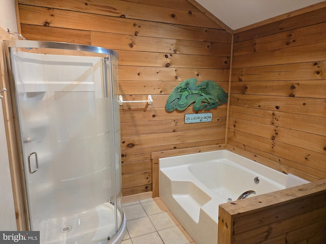 full bath with lofted ceiling, wood walls, tile patterned floors, a shower stall, and a garden tub