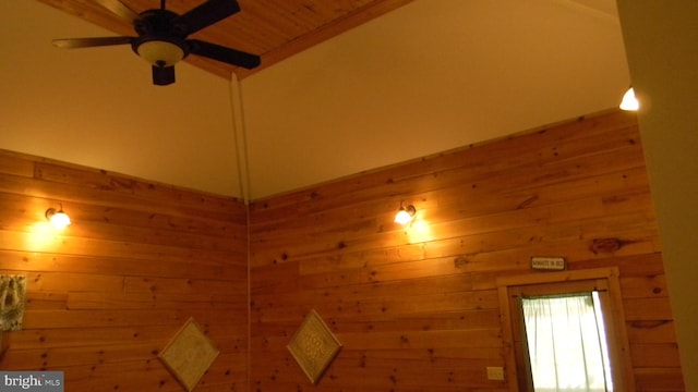 details featuring wood walls, wood ceiling, and ceiling fan