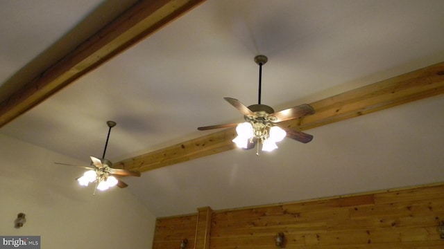 interior details with beamed ceiling and ceiling fan