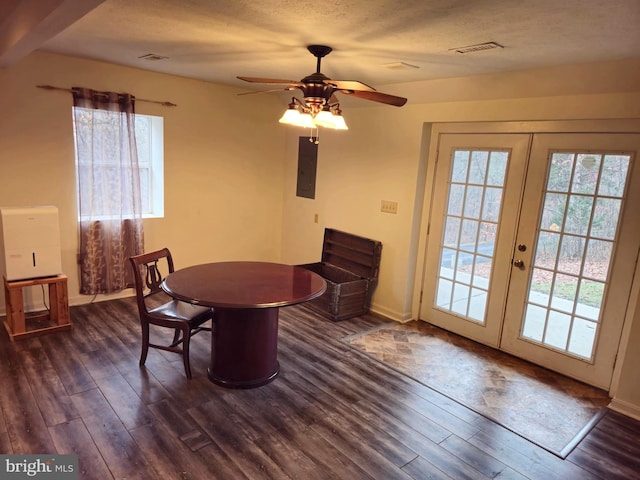 dining space with electric panel, dark wood-style flooring, french doors, and plenty of natural light