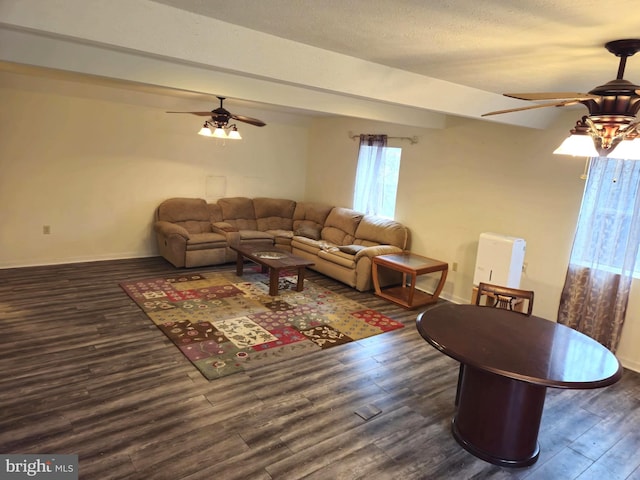living area featuring ceiling fan, baseboards, and wood finished floors