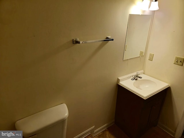 half bath with toilet and vanity