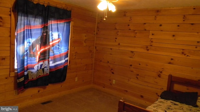 unfurnished bedroom featuring wooden walls