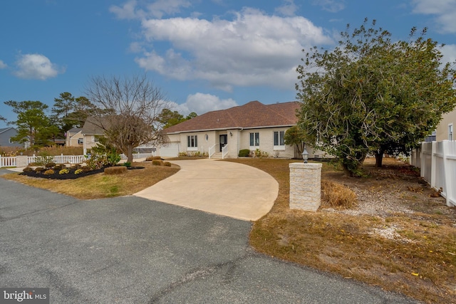 37763 Lagoon Ln, Ocean View, DE 19970 - ranch-style home featuring curved driveway and fence