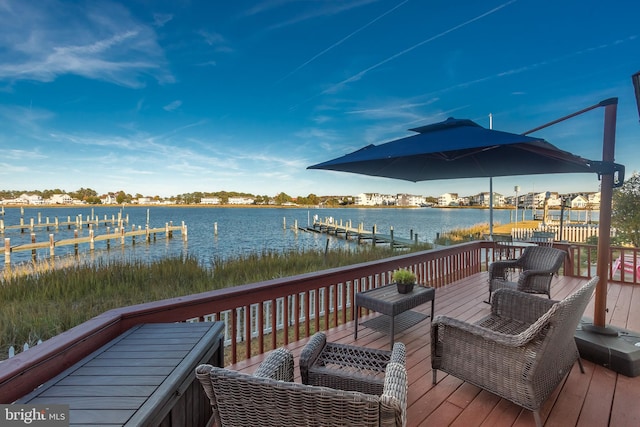 view of dock featuring a deck with water view