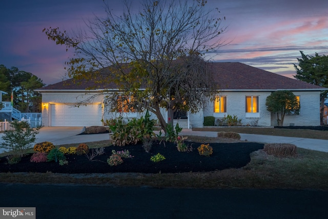 single story home featuring a garage