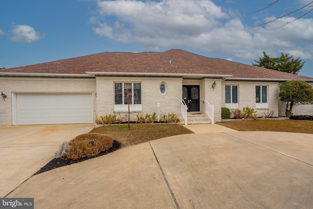 single story home featuring a garage