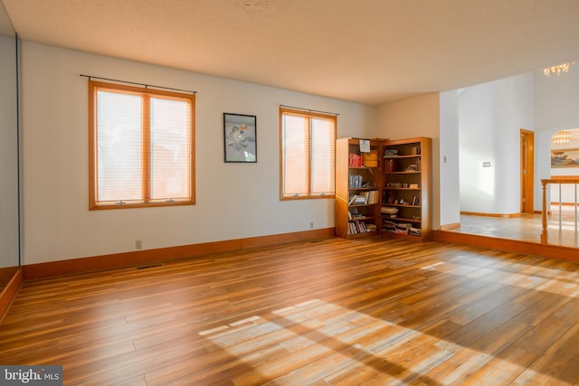 37763 Lagoon Ln, Ocean View, DE 19970 - unfurnished room with wood finished floors, a chandelier, and baseboards