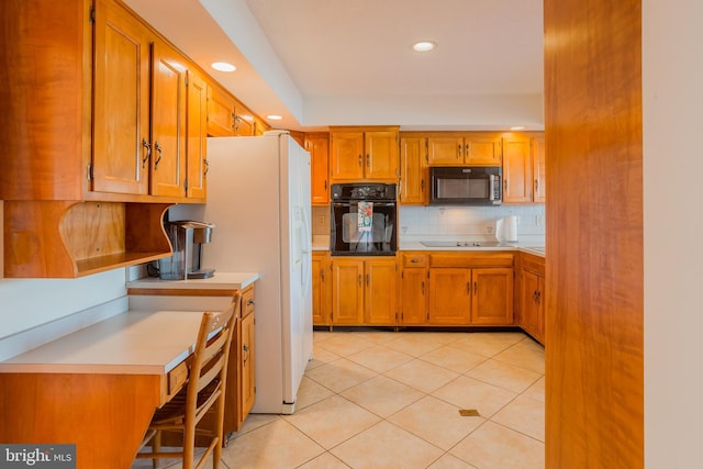 kitchen featuring black appliances, light tile patterned flooring, and backsplash