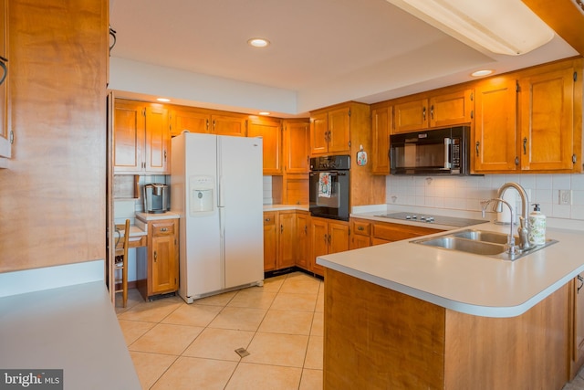 kitchen featuring kitchen peninsula, decorative backsplash, sink, black appliances, and light tile patterned floors