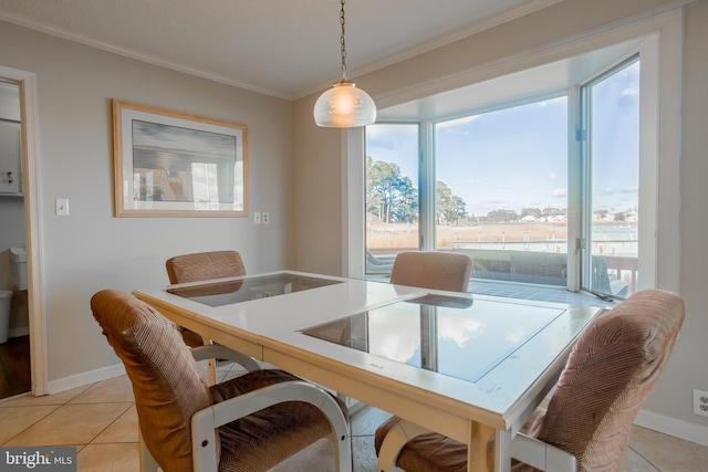 tiled dining area with crown molding