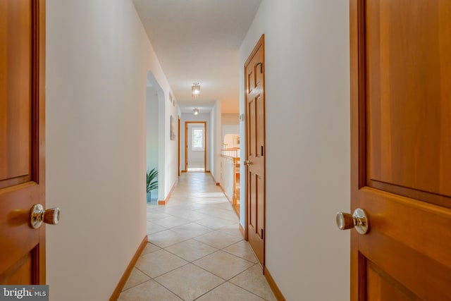 hallway with light tile patterned floors