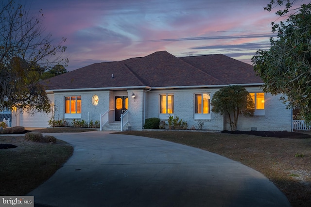 single story home with a lawn