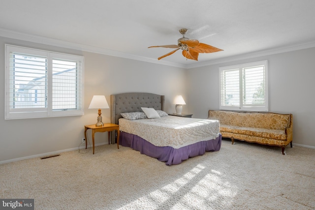 bedroom featuring carpet flooring, ceiling fan, and crown molding