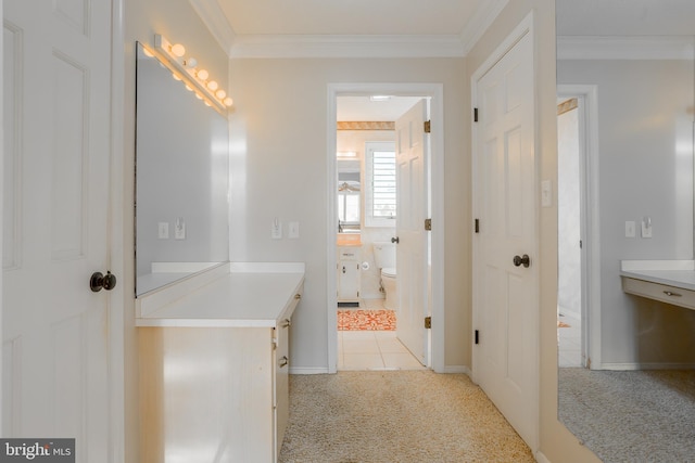 bathroom with toilet and ornamental molding