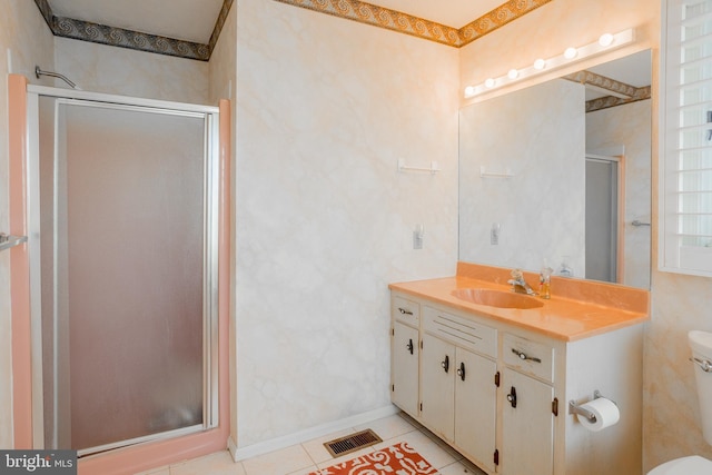 bathroom with vanity, toilet, and walk in shower