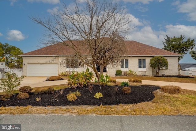 37763 Lagoon Ln, Ocean View, DE 19970 - single story home with driveway, an attached garage, and a shingled roof