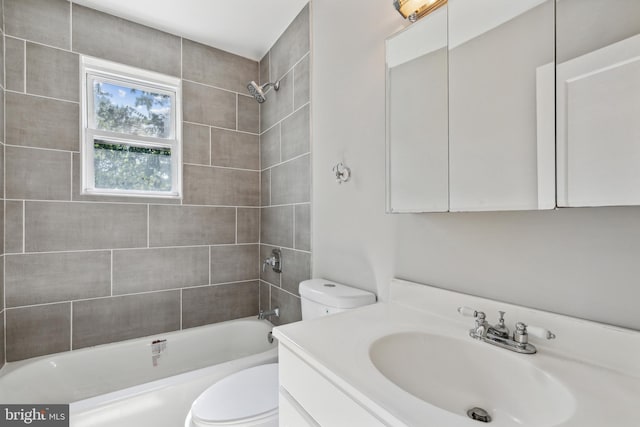 full bathroom featuring vanity, toilet, and tiled shower / bath