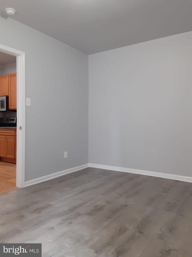 empty room with light hardwood / wood-style floors