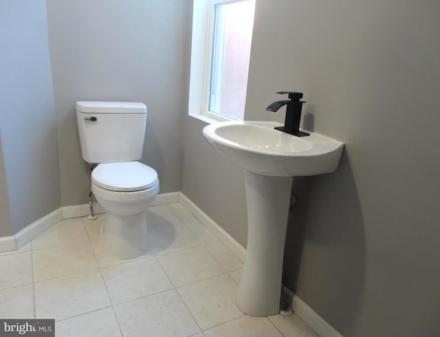 bathroom featuring tile patterned floors and toilet