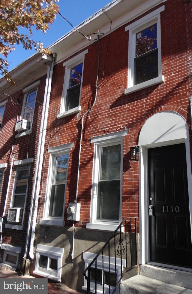 exterior space featuring brick siding