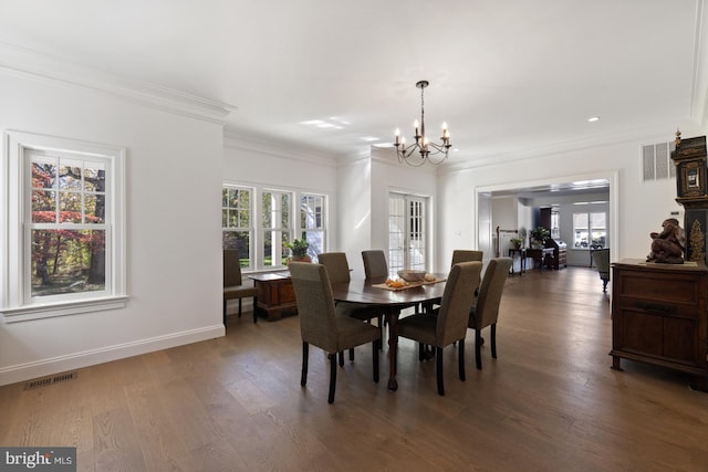 dining area with an inviting chandelier, crown molding, plenty of natural light, and dark hardwood / wood-style flooring