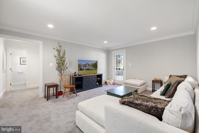 living room with ornamental molding and light colored carpet