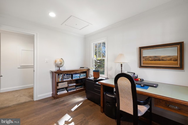 home office featuring ornamental molding and dark hardwood / wood-style floors