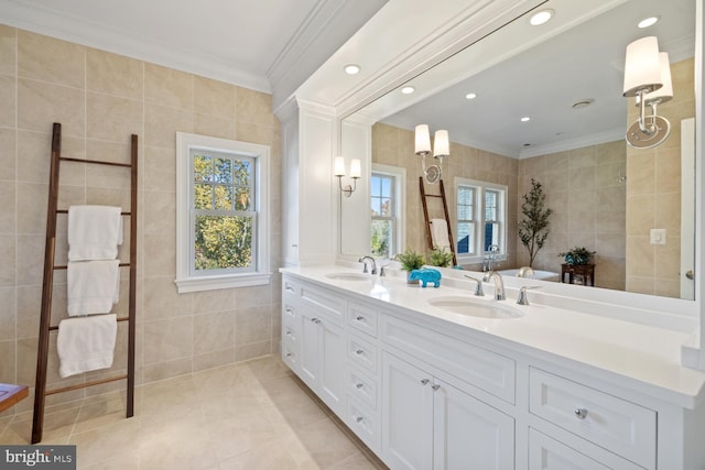 bathroom featuring vanity, tile walls, a wealth of natural light, and ornamental molding