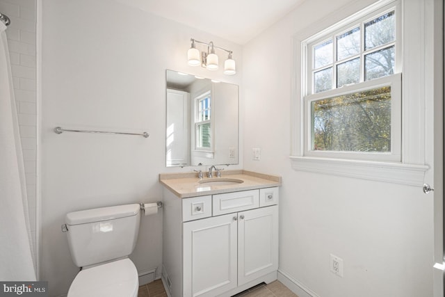 bathroom with vanity, a shower with shower curtain, toilet, and plenty of natural light