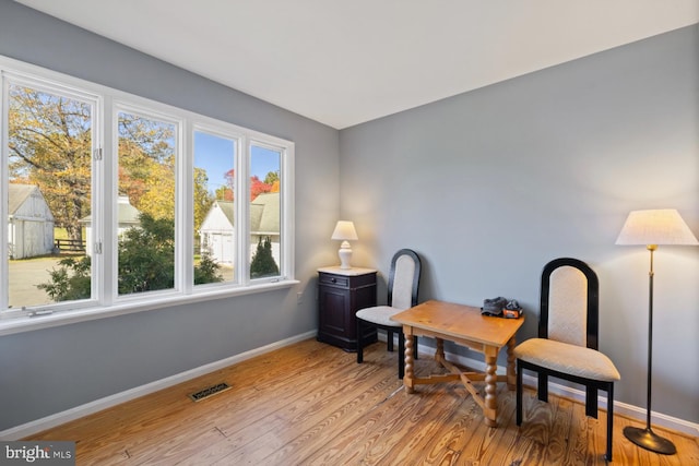 office with light hardwood / wood-style floors