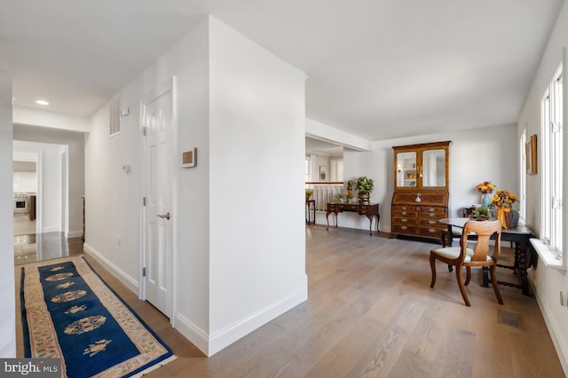 corridor featuring hardwood / wood-style flooring