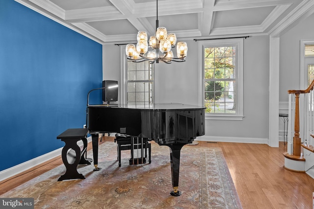 misc room featuring ornamental molding, hardwood / wood-style floors, beamed ceiling, and coffered ceiling