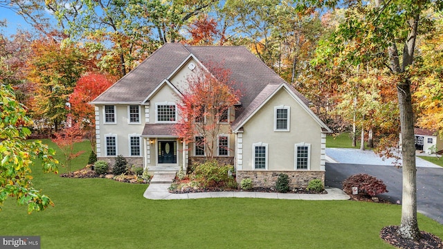 view of front of property with a front lawn