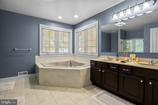 bathroom with vanity, shower with separate bathtub, and tile patterned floors