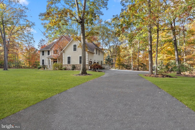 view of home's exterior with a lawn