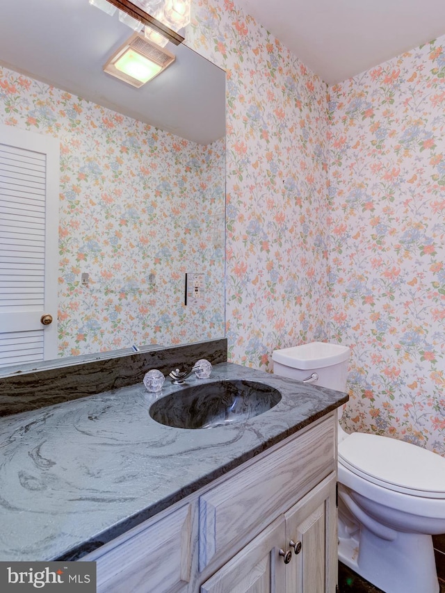 bathroom with vanity and toilet